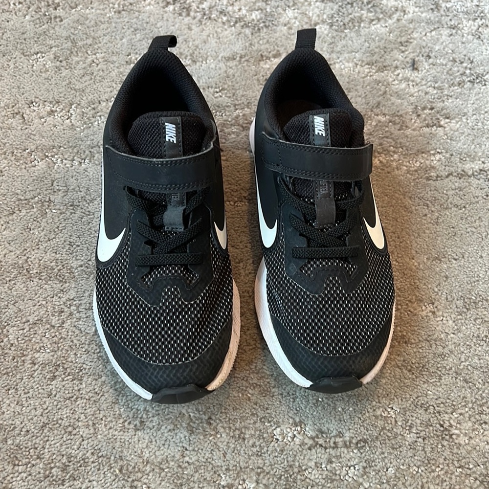 NIKE black, and white slip on sneakers with Velcro